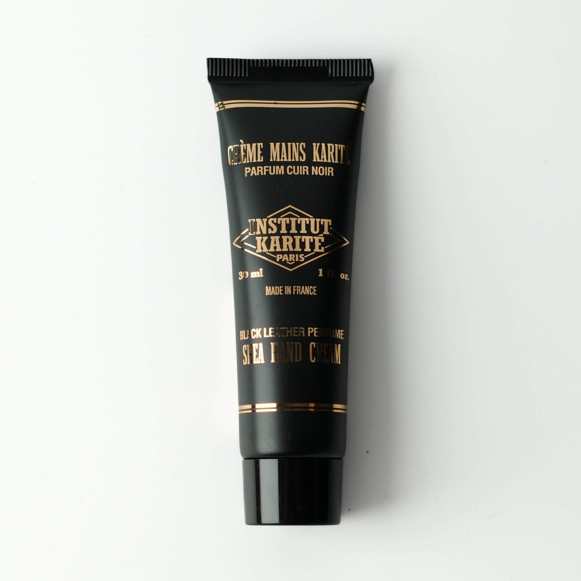 Front view of 30mL Black Leather Shea Hand Cream by Institut Karité Paris