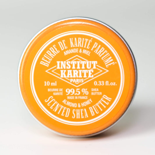 Front view of 10mL Almond and Honey Scented Shea Butter tin by Institut Karité Paris