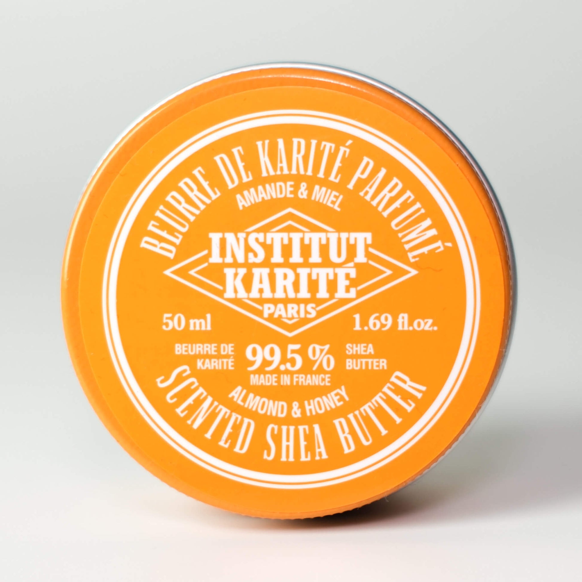 Front view of 50mL Almond and Honey Scented Shea Butter tin by Institut Karité Paris